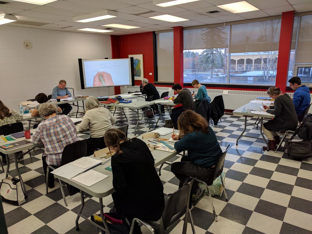 Instructor Rick Draffin reviews the basic proportions of Roman skeletal letters on the overhead projector